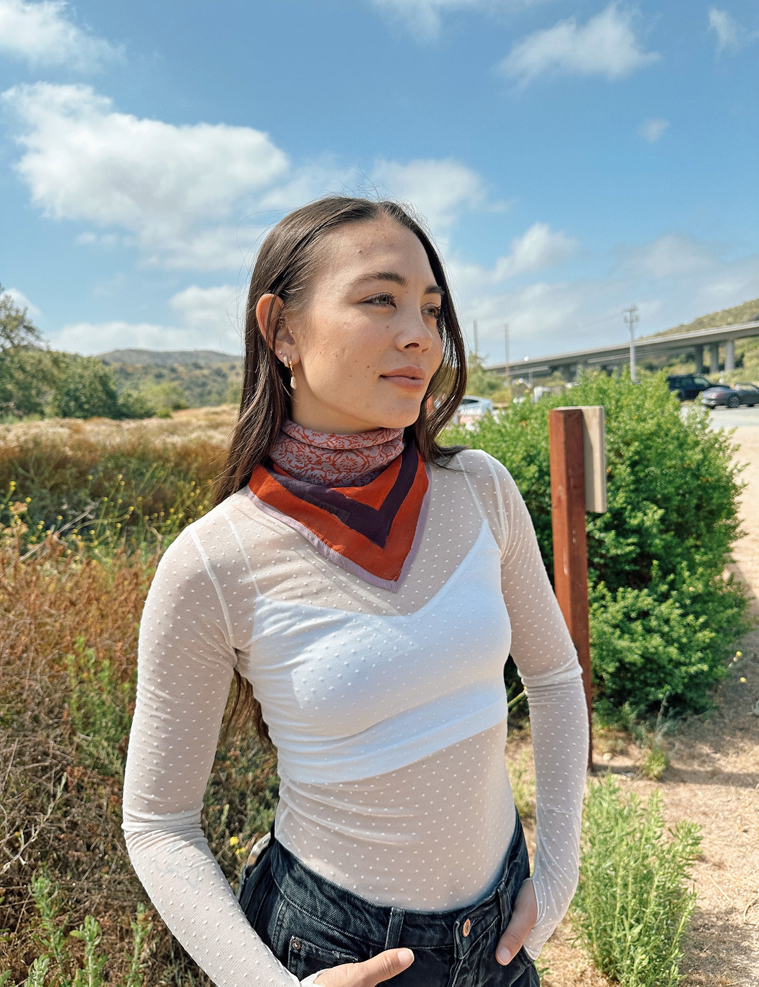 Block printed floral printed Eva bandana tied around neck, styled with white sheer long sleeve