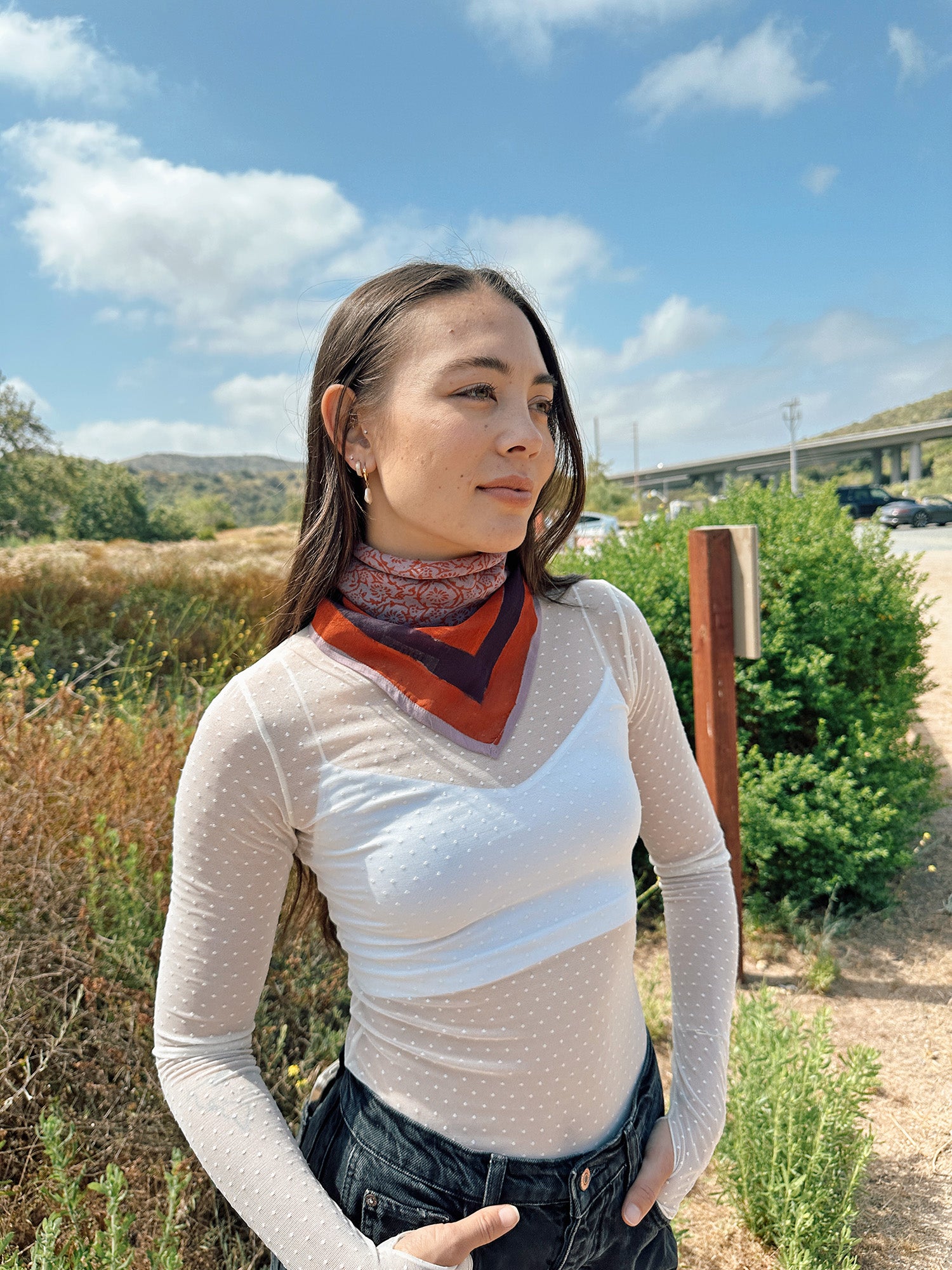 Block printed floral printed Eva bandana tied around neck, styled with white sheer long sleeve