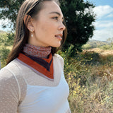 Block printed floral printed Eva bandana tied around neck, styled with white sheer long sleeve