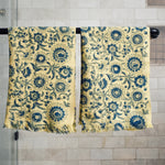 Block printed tropic inspired floral print waffle weave khadi hand towels hanging on a shower rod