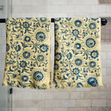 Block printed tropic inspired floral print waffle weave khadi hand towels hanging on a shower rod