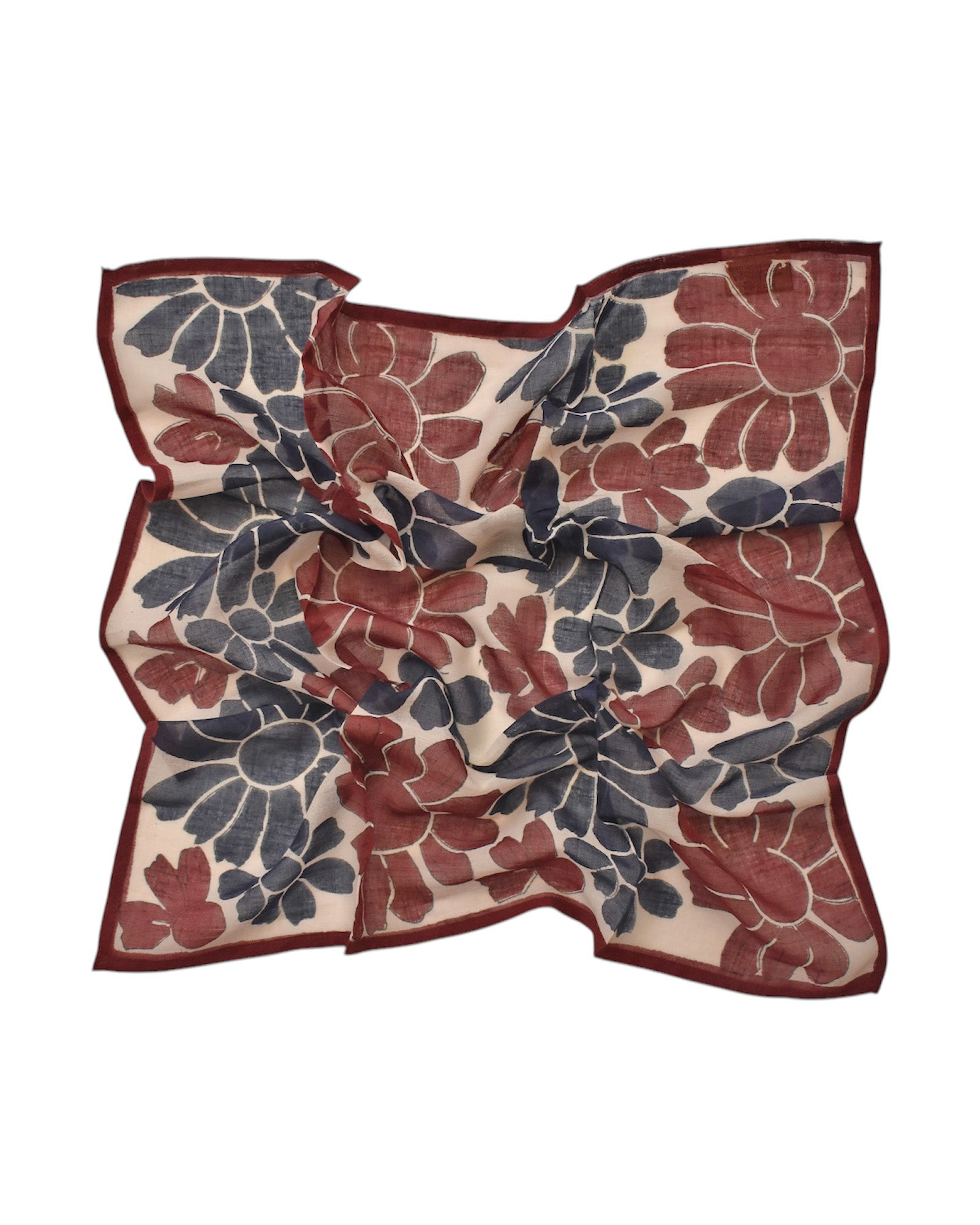 Block printed Flora bandana, laid flat and scrunched up. Bandana has a large, all over floral print.