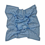 Block printed Angelite bandana, laid flat and scrunched up. Bandana has a floral print.