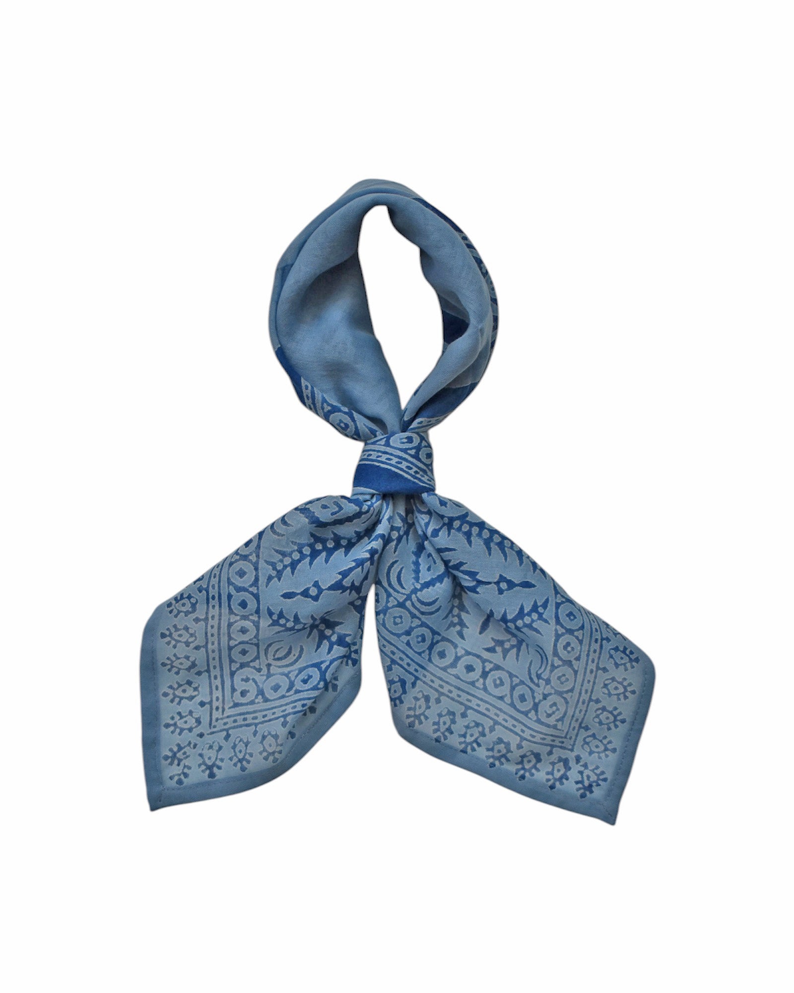 Block printed Angelite bandana, tied up. Bandana has a floral print.