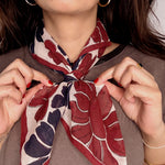 Woman wearing block printed floral Flora bandana around the neck