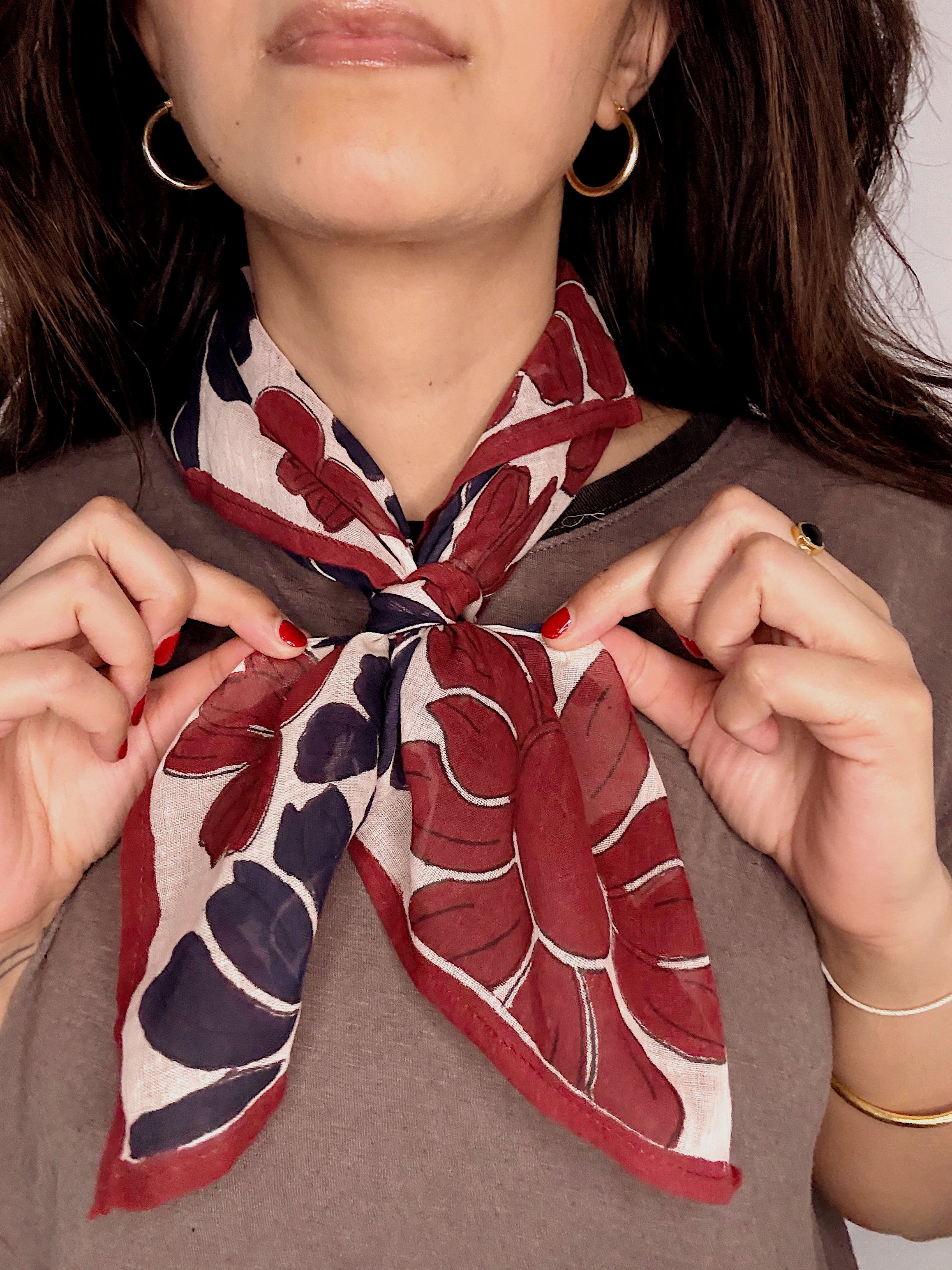 Woman wearing block printed floral Flora bandana around the neck