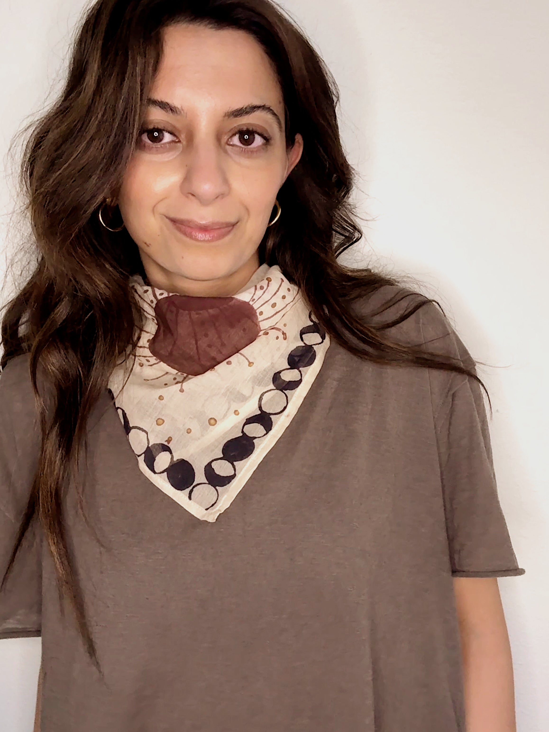 Woman wearing block printed starry Astral bandana around the neck