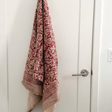 Patterned towel hanging on a white door