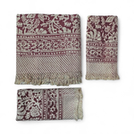 Set of three patterned scarves on a white background