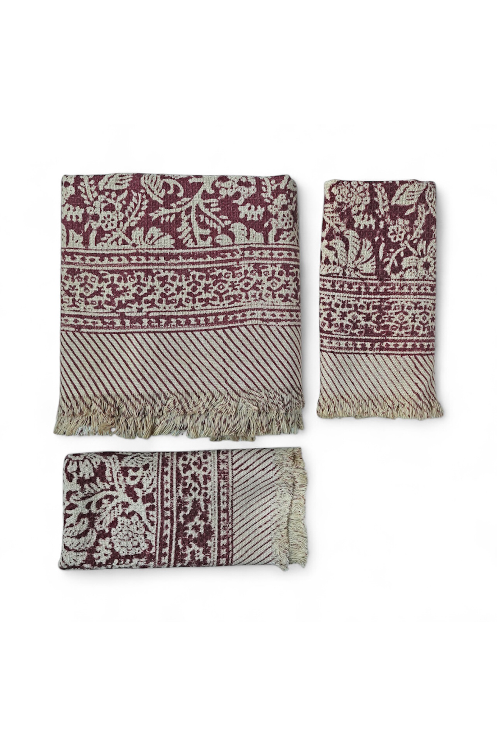 Set of three patterned scarves on a white background