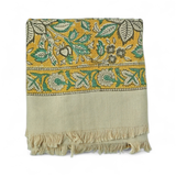 Decorative bath towel with a yellow floral pattern on a white background