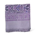 Floral printed purple bath towel folded on white background