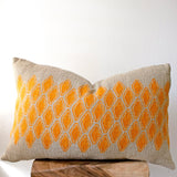 Sol Block Print Pillow on a stool against white