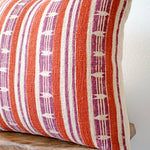 Mojave block print pillow on a stool against white, angled