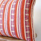 Mojave block print pillow on a stool against white, angled