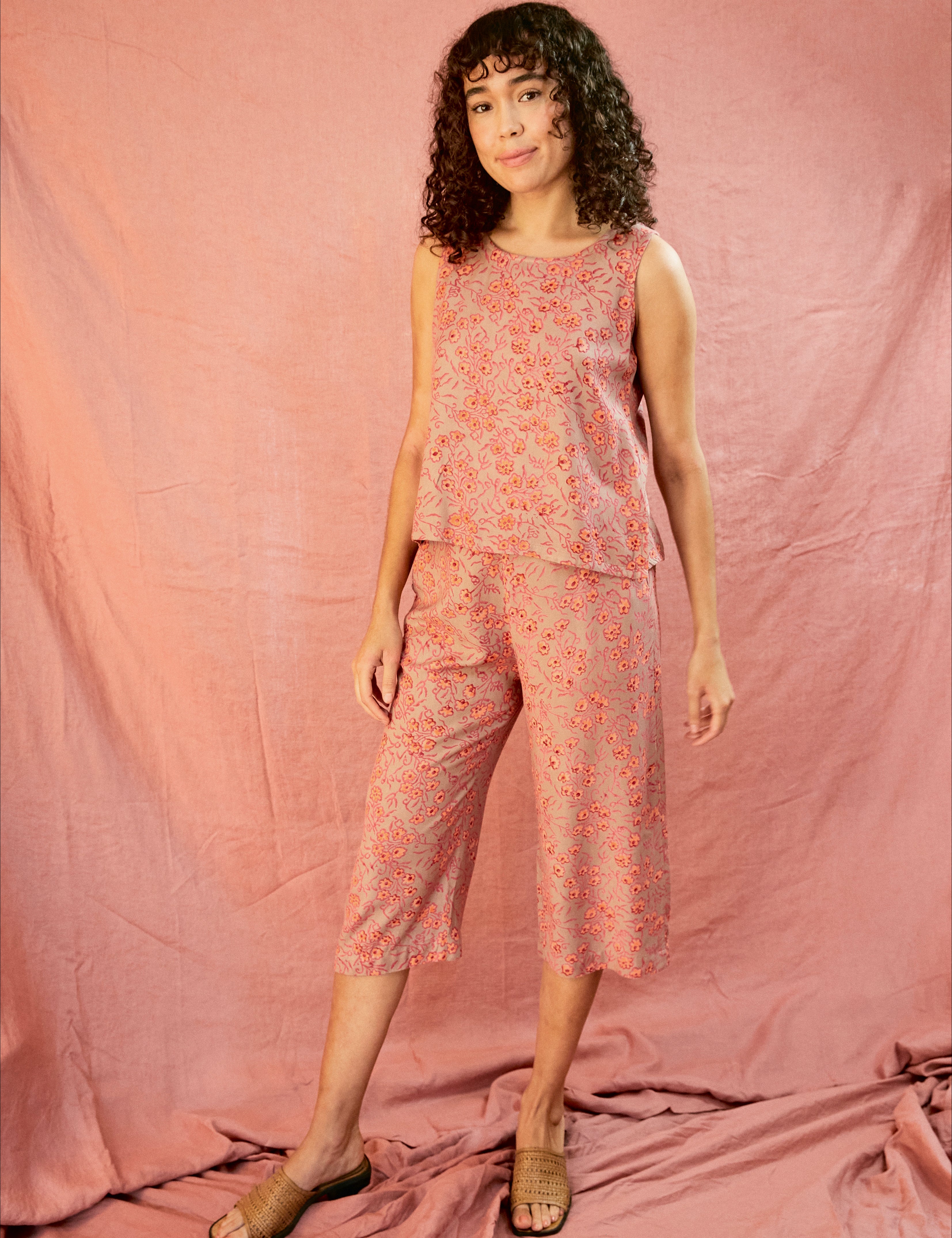 Model wearing the Birkin set, against a blush pink background