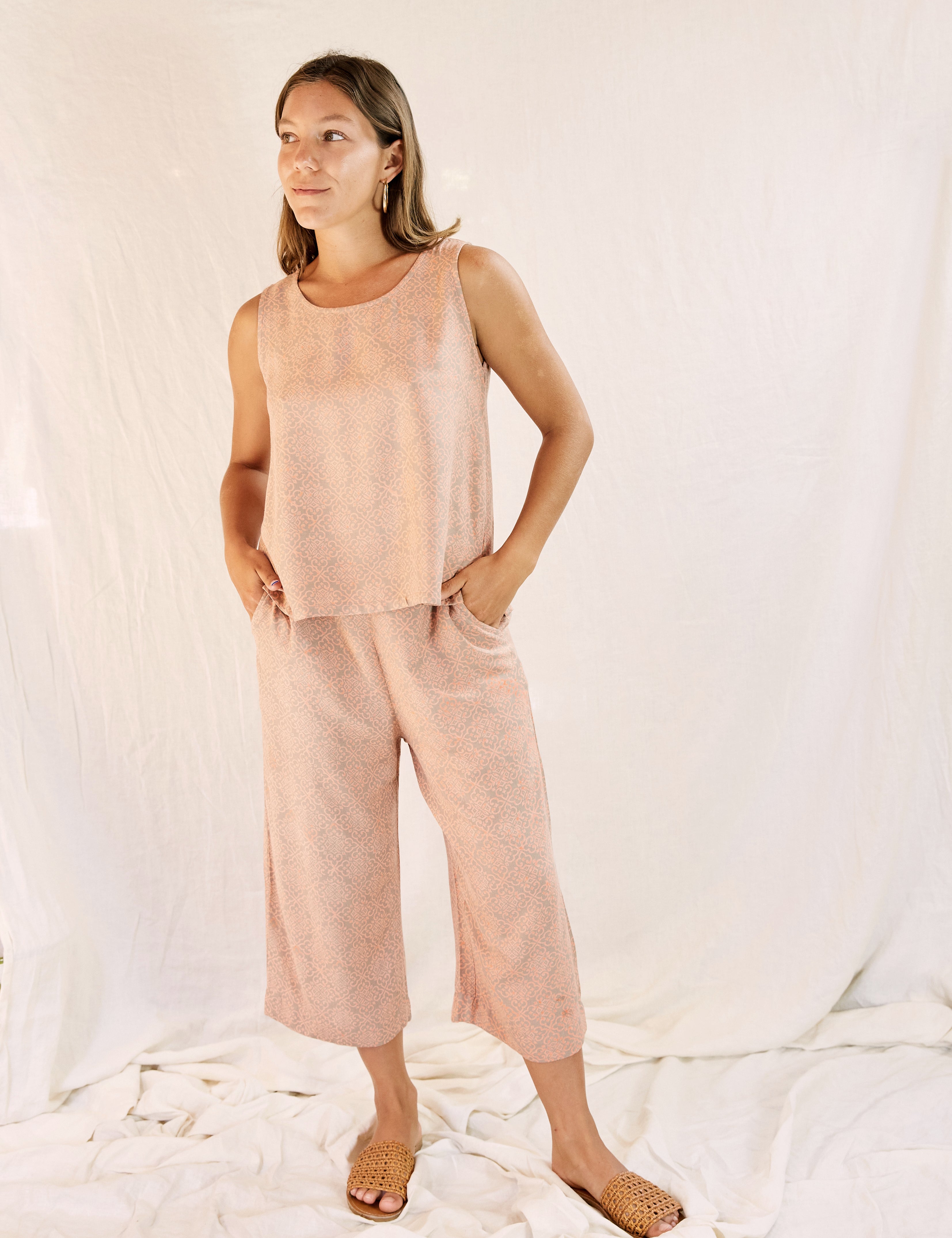 Model wearing the Alba set, against a cream color background