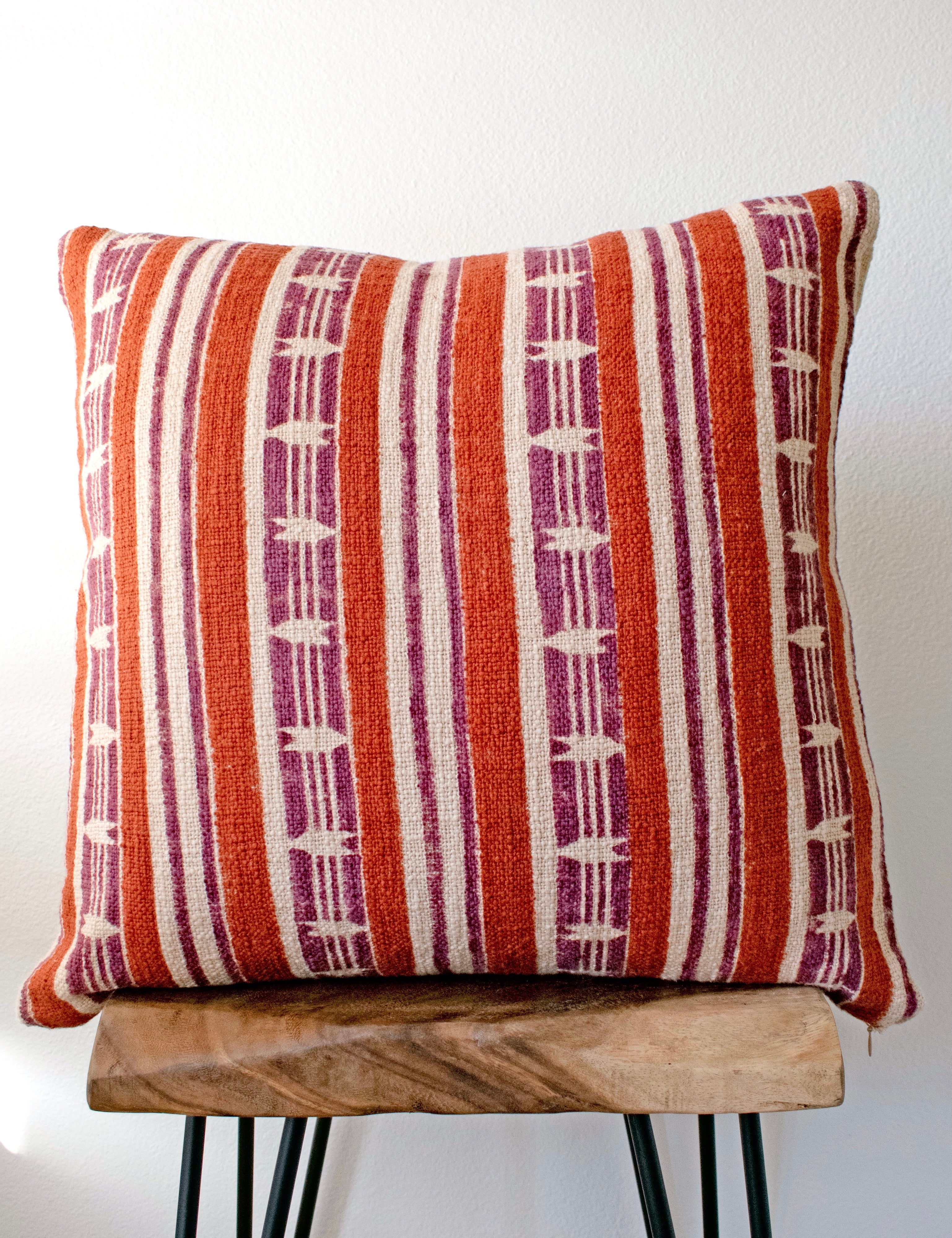 Mojave block print pillow on a stool against white