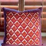 Pitaya block print pillow on a wooden desk