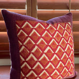 Pitaya block print pillow on a wooden desk, angled