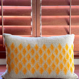 Sol Block Print Pillow on a wooden table