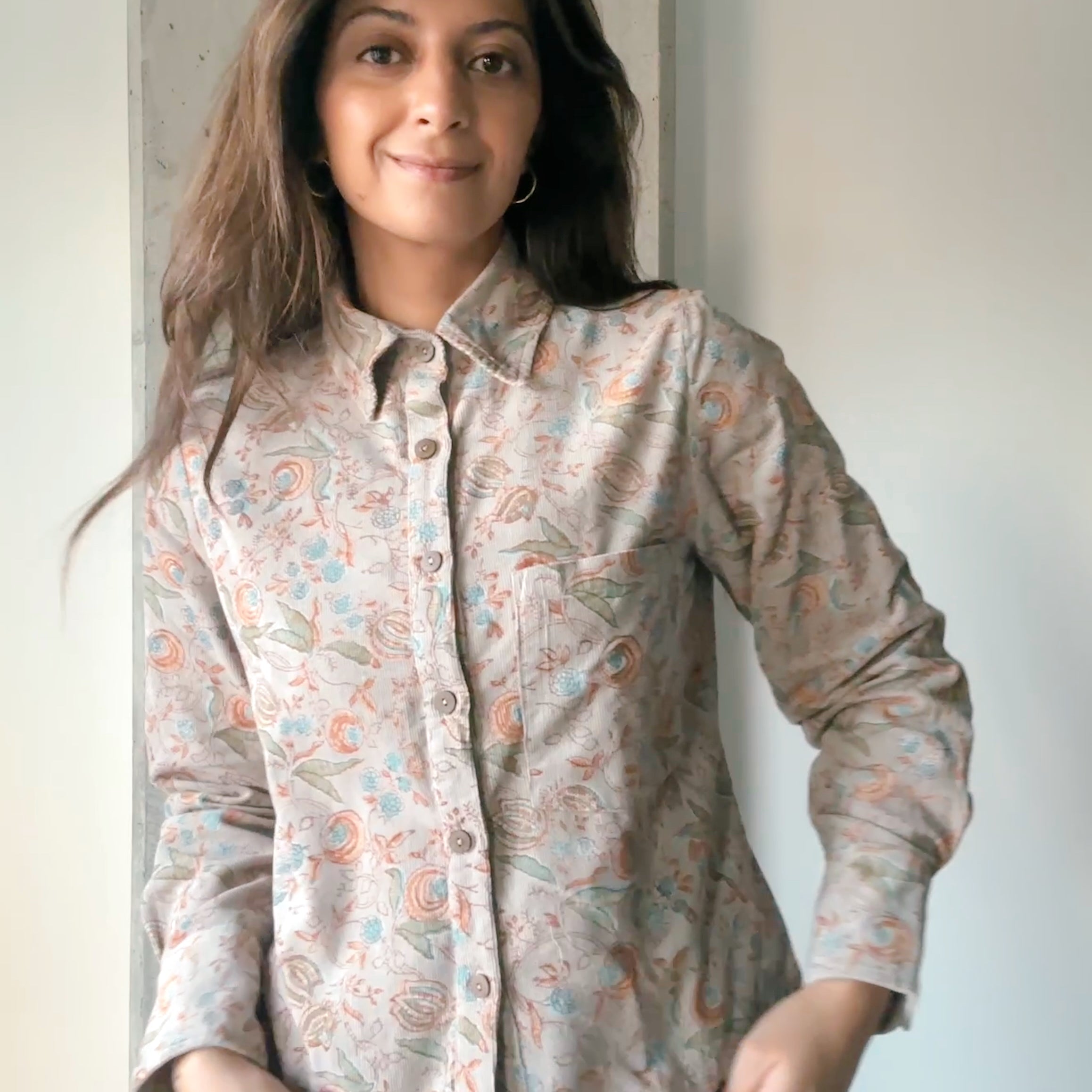 Woman wearing block printed corduroy floral printed Helena Shirt, front shot