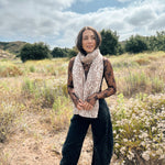 Block printed floral printed chunky wool scarf wrapped around neck, styled with sheer brown long sleeve and denim jeans