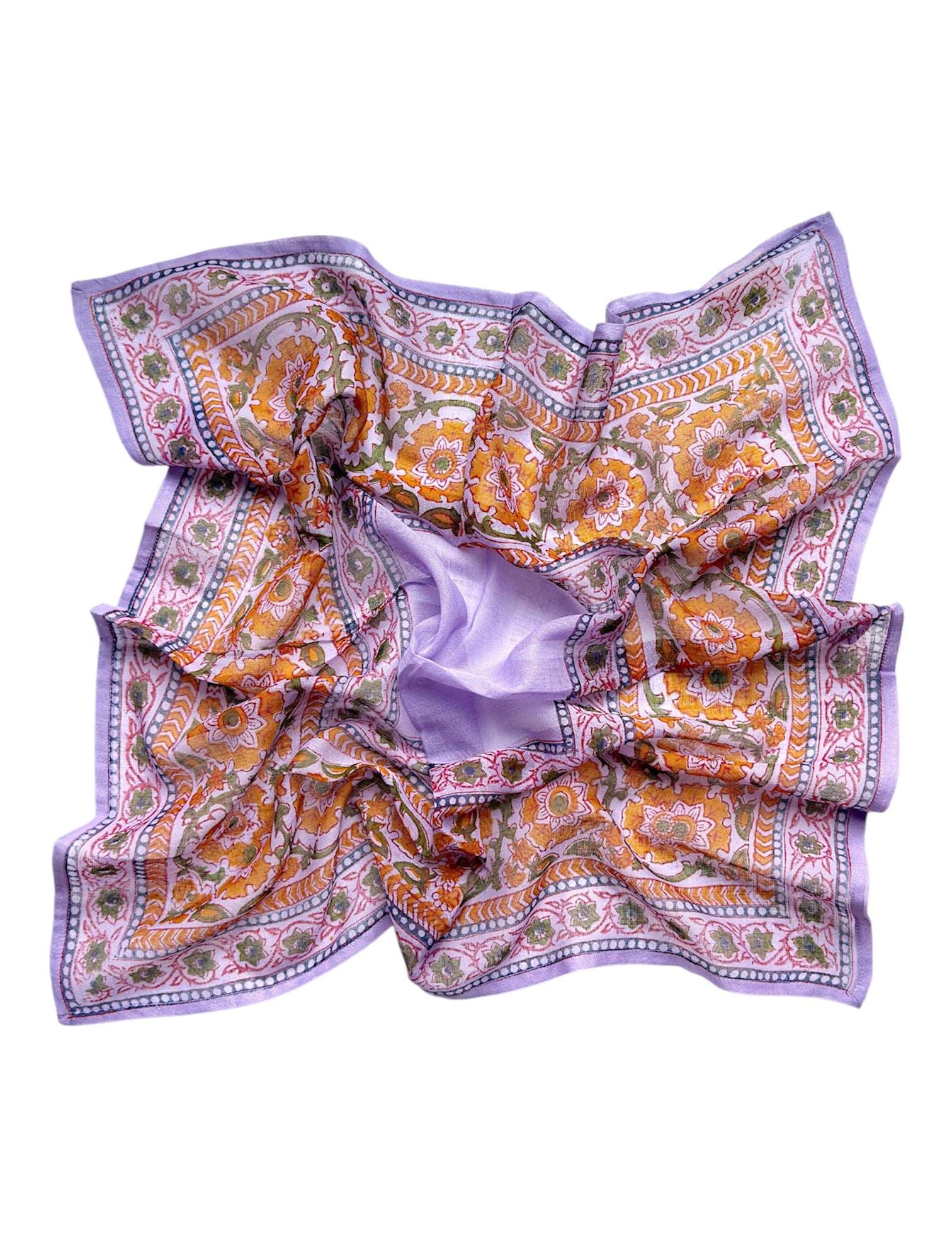 Chamomile bandana scarf laid flat on white background. Scarf has a lavender background with a green floral border print, and yellow flowers towards the center.