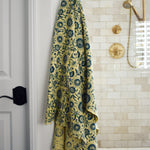 Block printed floral print waffle weave bath towel hanging on a hook