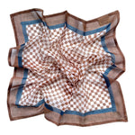 Checkered bandana scarf with brown and white pattern laid flat on a white background
