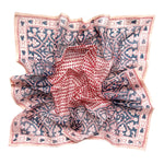 Decorative block printed bandana scarf with blue and red floral print, laid flat on a white background