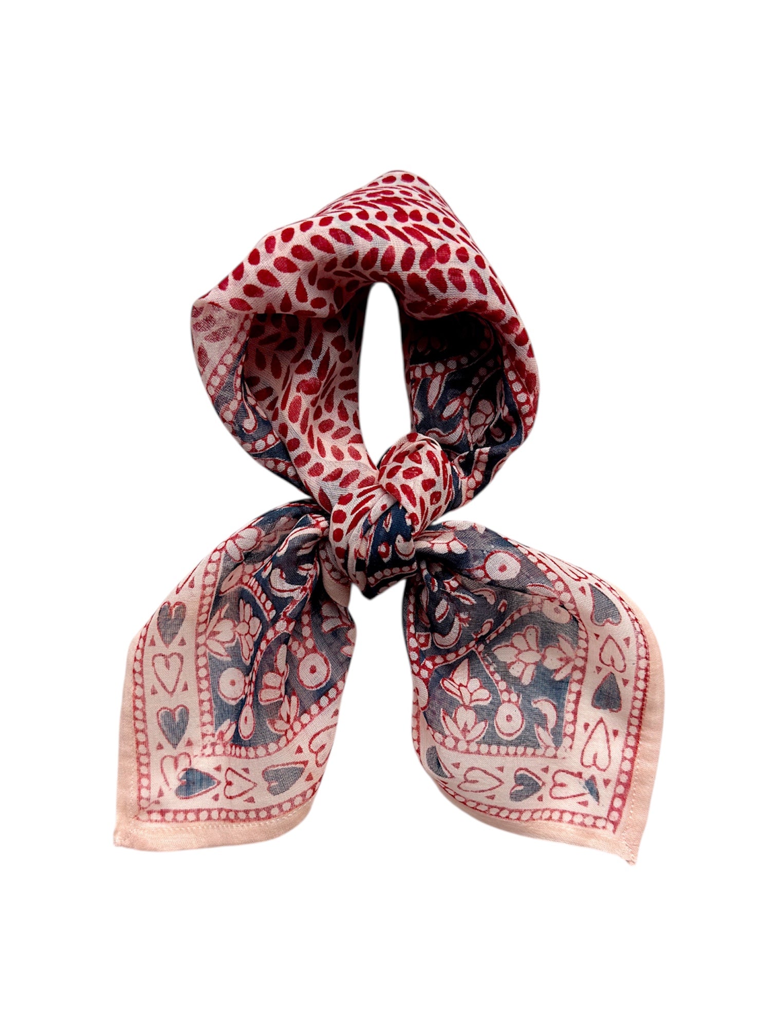 Decorative block printed bandana scarf with blue and red floral print, tied on white background