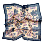 Blue and lavender floral printed bandana scarf, laid flat on a white background