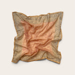 Terracotta Daisy Motif Bandana Scarf in lightweight cotton flat lay display featuring rust-red daisy lattice center and charcoal geometric border against off-white background
