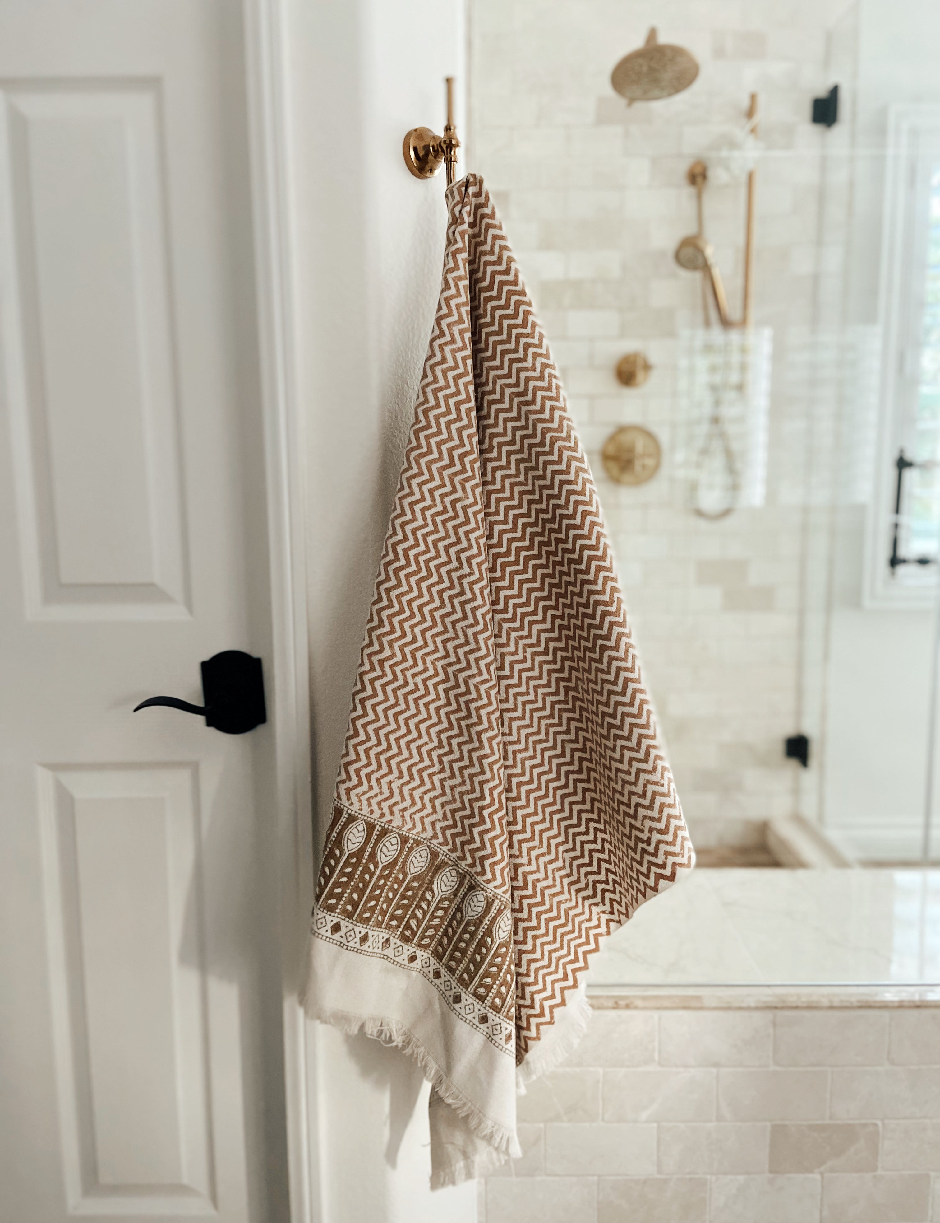 Dakota bath towel hanging on rod in the bathroom