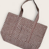Checkered and striped tote bag laid flat 