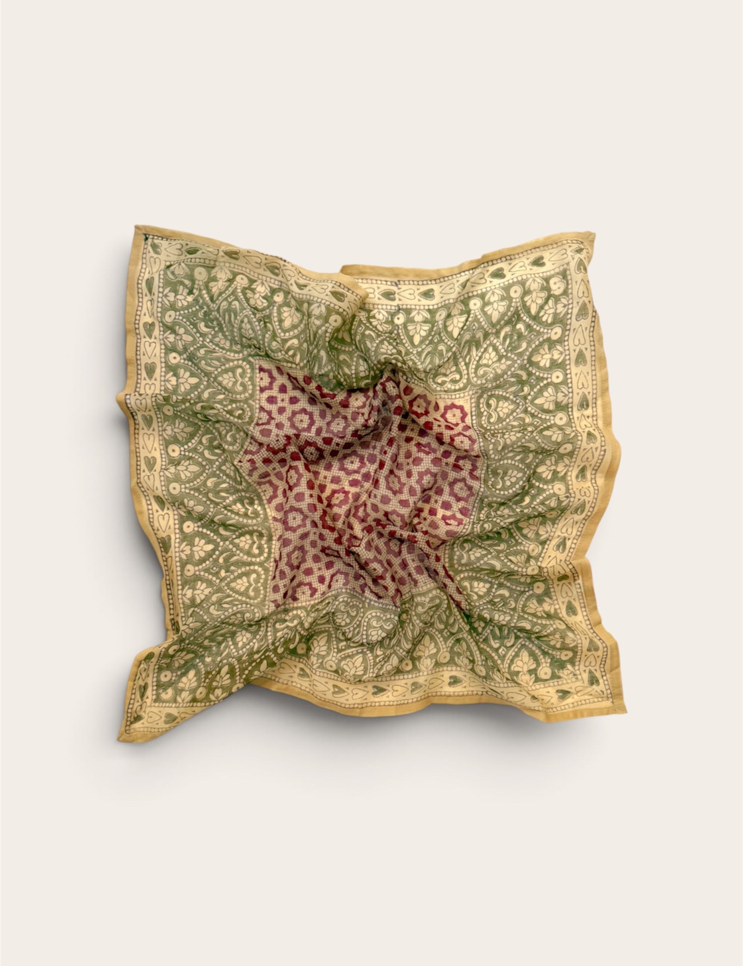Sage & Mulberry Heart Motif Bandana Scarf in lightweight cotton flat lay display featuring deep mulberry center grid with sage green floral and heart border against off-white background
