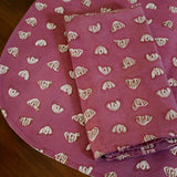 Purple floral printed placemats with matching table napkin on a wooden table