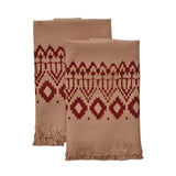Block printed Terracotta hand towels, folded and laid flat. Towels have a geometric, diamond print. 