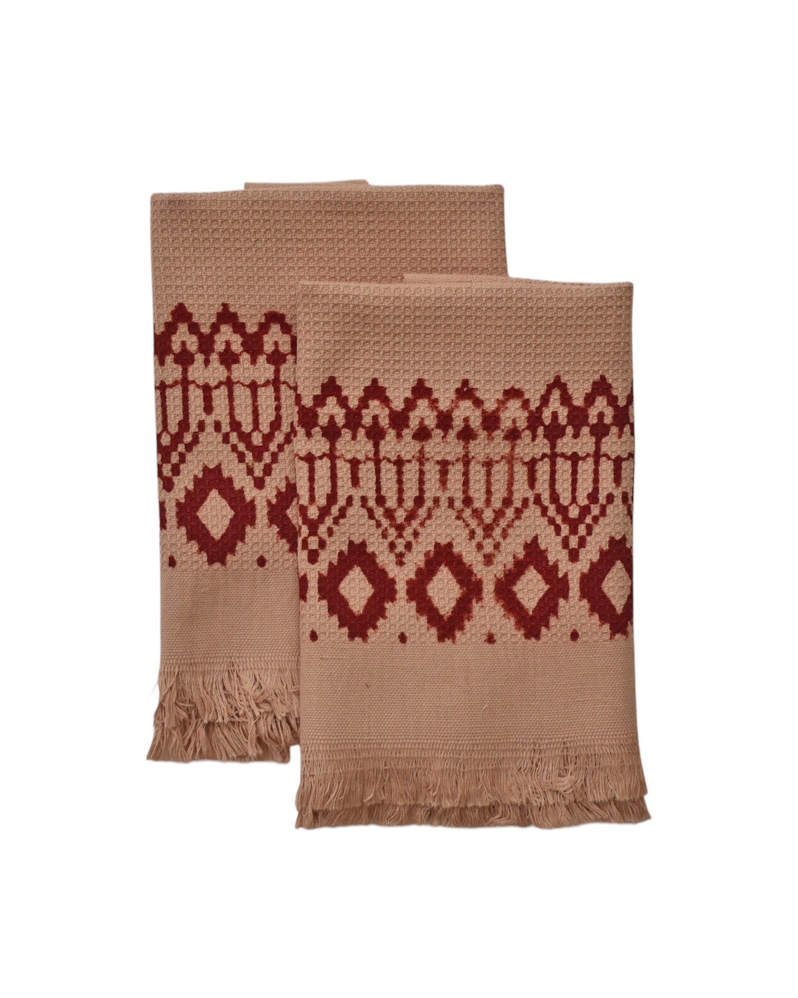 Block printed Terracotta hand towels, folded and laid flat. Towels have a geometric, diamond print. 