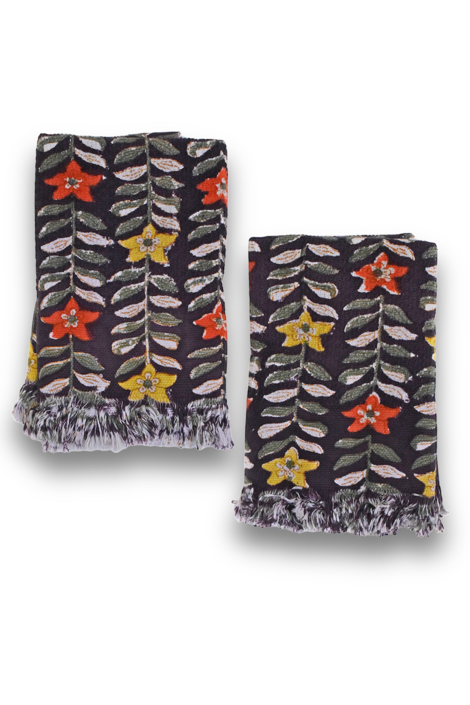 Two Selena block printed hand towels folded and placed next to each other on a white background