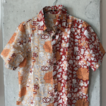 Floral patterned shirt hanging on a concrete wall