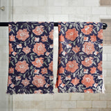 Block printed rose floral hand towels hanging on a shower rod