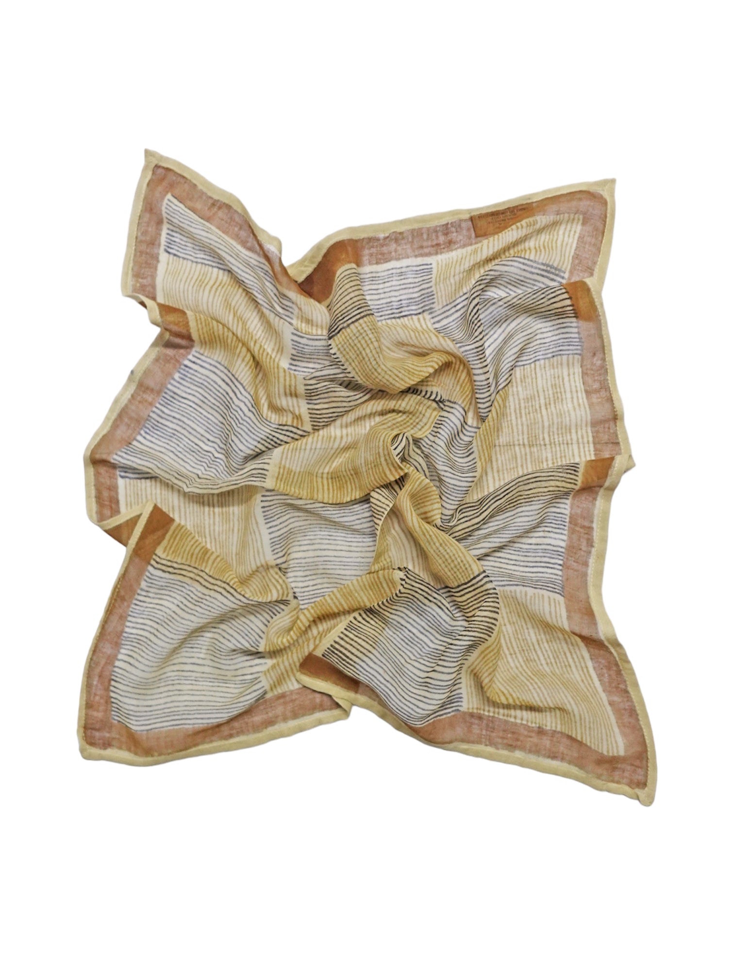 Vertical and horizontal striped block printed Savanna bandana laid flat against a white background
