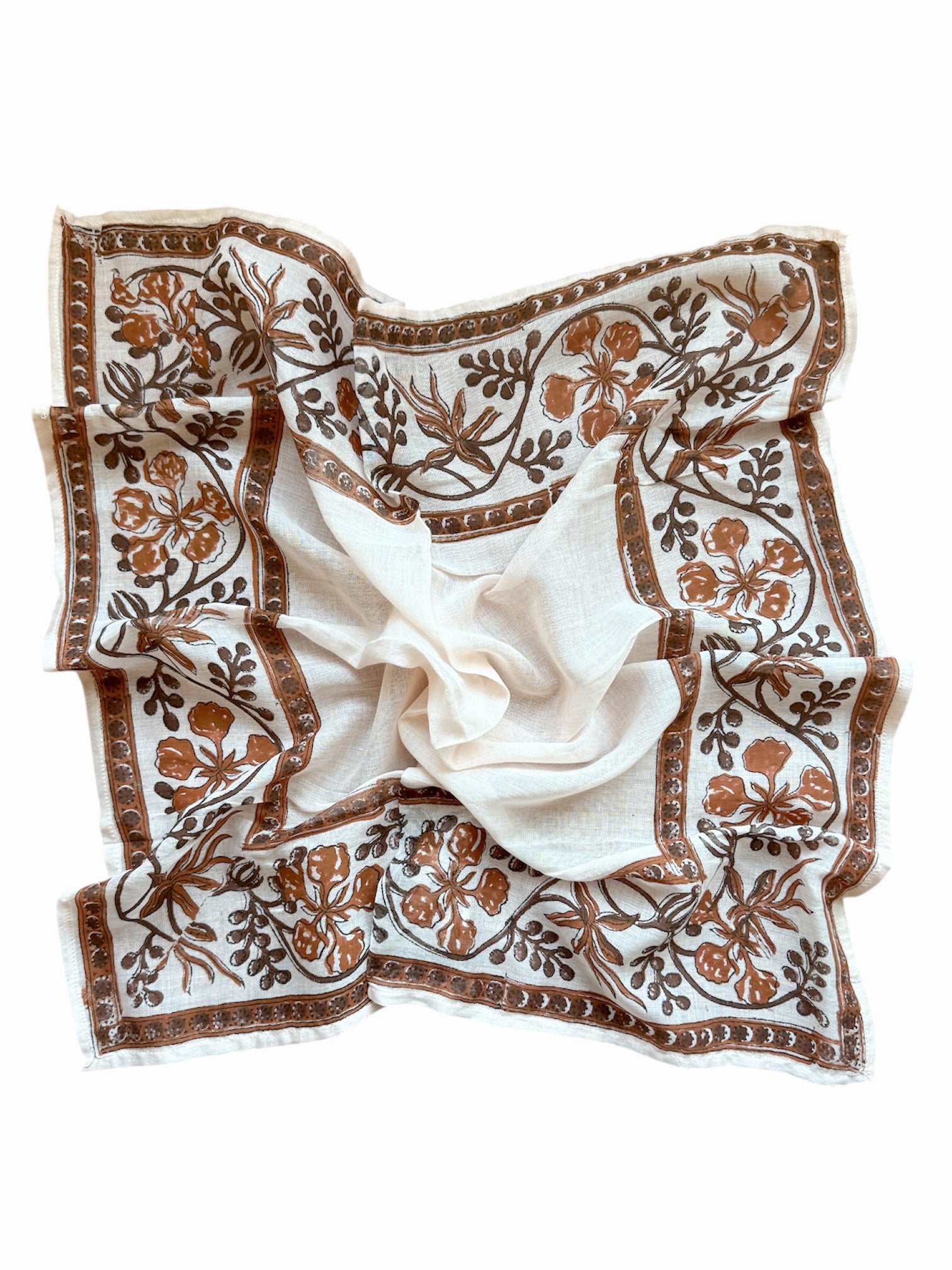 White scarf with brown floral print on a white background