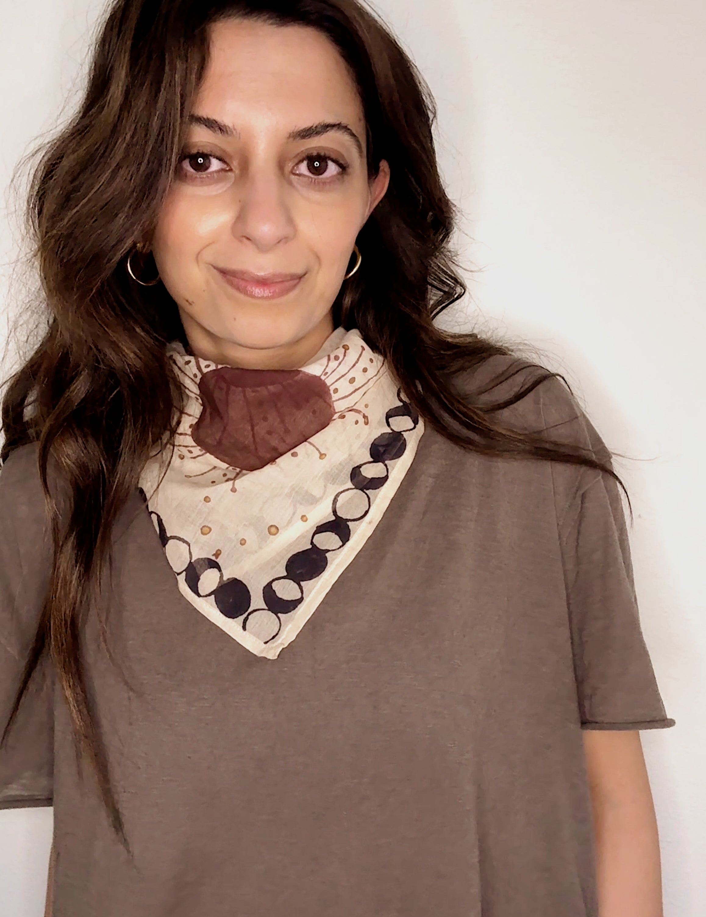 Woman wearing block printed starry Astral bandana around the neck