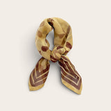Golden Ochre Floral Bandana Scarf styled tied in a loose neck knot showing plum floral block print and bordered ends on off-white background