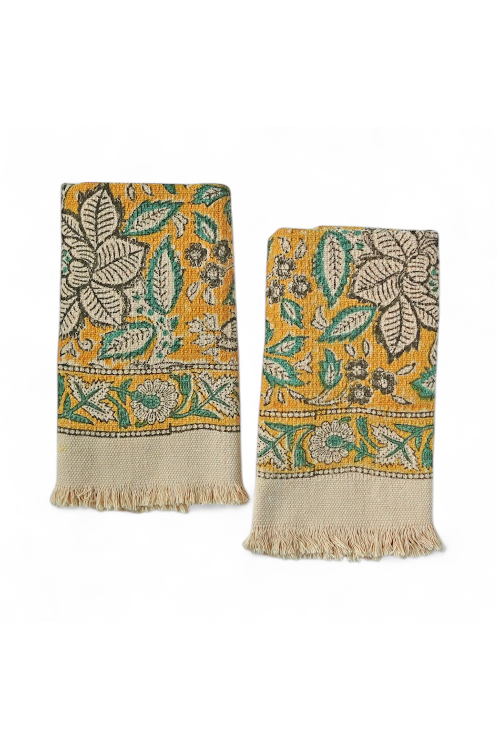 Two decorative towels with yellow floral patterns on a white background