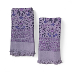 Two purple floral patterned hand towels on a white background