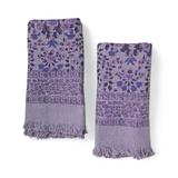Two purple floral patterned hand towels on a white background